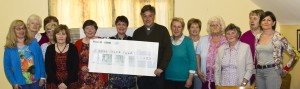 Gaultier ICA members presenting a cheque for €1,400 to Fr Brian Power towards the Killea Church Restoration Fund.
