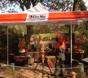 John at an Oleo-Mac demonstration with some of his creations.