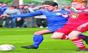 Winger Ryan Lambe takes on the Cork City defence 