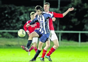 Waterford’s Michael O’Neill gains control ahead of Cork’s Troy O’Sullivan.