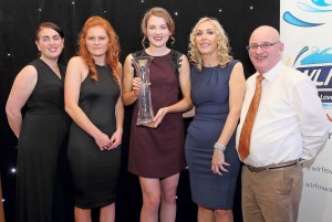 Patricia Jackman IS pictured with the May Monthly winner, Beth Carton and members of the Waterford County Camogie Board (2015), Roisín Hartley (PRO), Ita Murphy (Chairperson) and John C Flood.