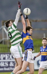 Ballinacourty's James O'Mahony in aerial action with An Rinn's Ferdia Ó hAodha.  