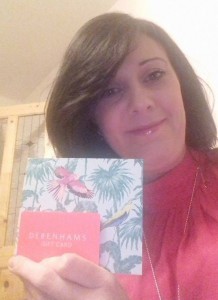 A delighted Caroline Whelan with her gift voucher which she received from a kind stranger.