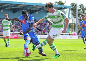 Waterford FC’s Izzy Akinade is tackled by Shamrock Rovers Sam Bone.