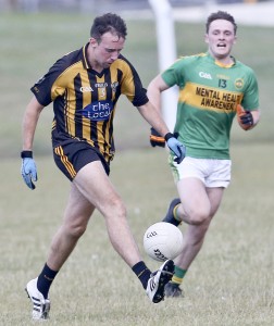 Brickey Rangers' Phillip Walsh solos past Kilrossanty's Josh Kay. 