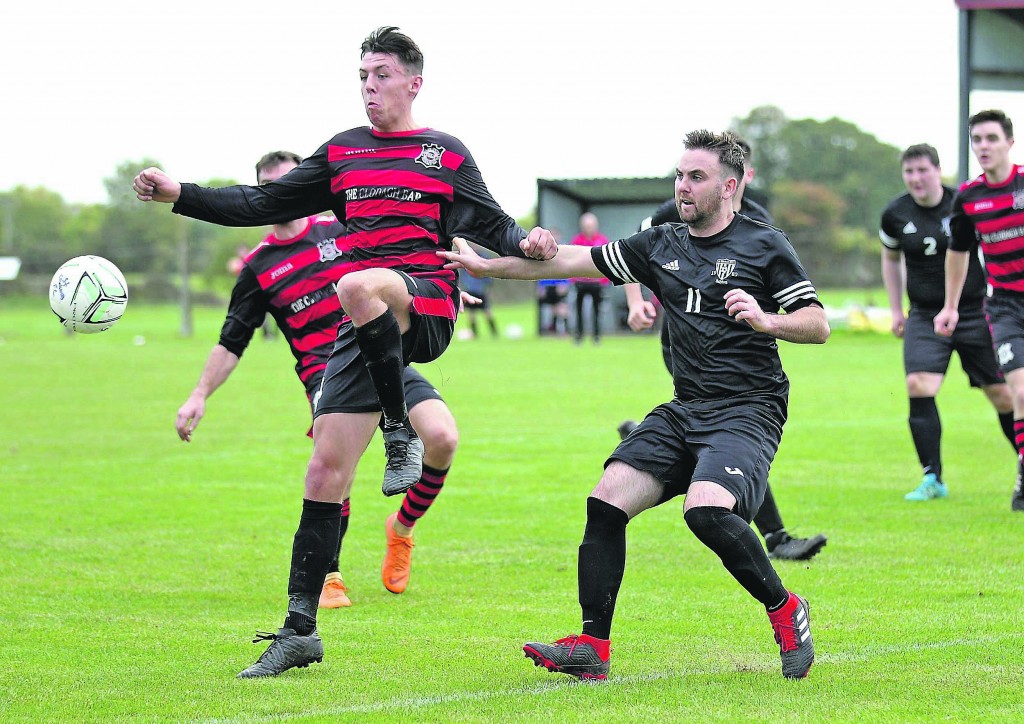 Portlaw’s Jordan Myler out in front of St.Saviour’s Stephen Dalton. O’Regan