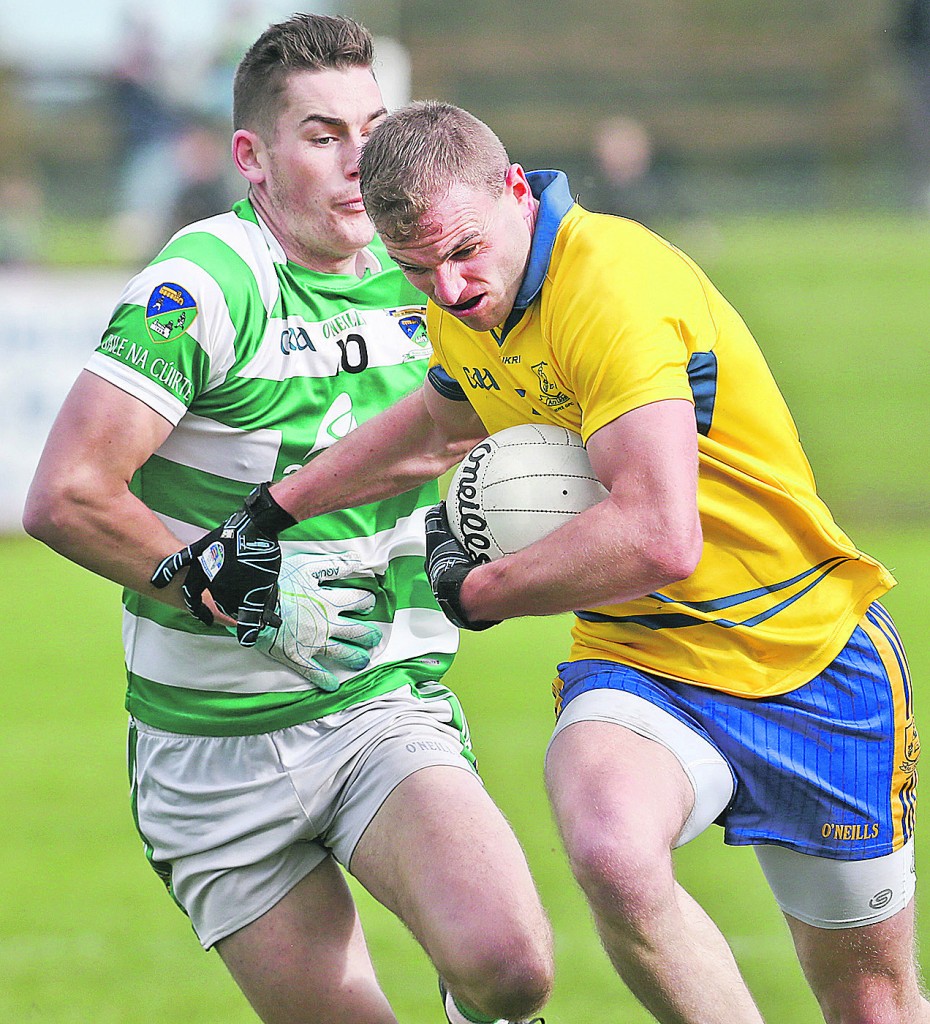 The Nire's James McGrath attempts to fend off Ballinacourty's Neil Montgomery during Sunday's Senior Football Semi-Final at Fraher Field. Photo by Sean Byrne