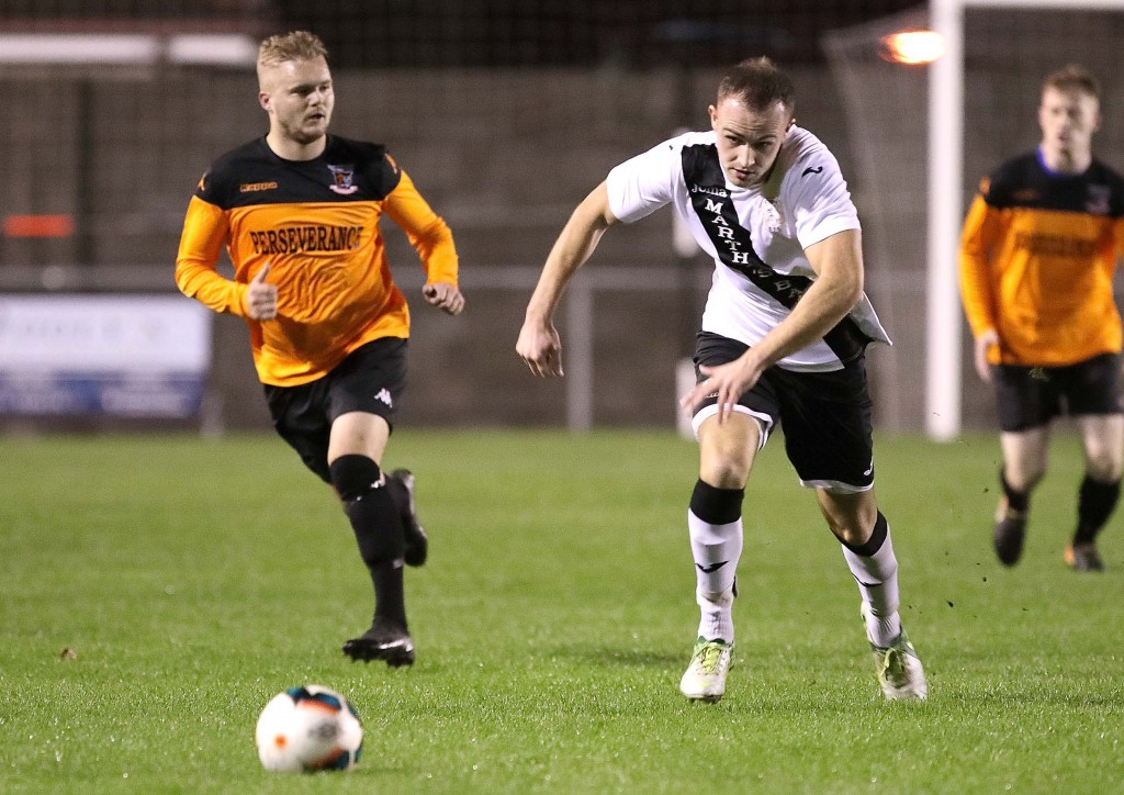 Tramore’s Conor McGough in control against Southend’s Glen Hawe.