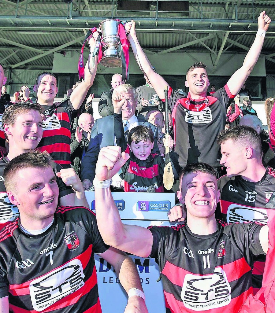 The joint captains of Ballygunner, Shane O’Sullivan and Stephen O’Keeffe raise the AIB Munster Club Championship trophy after it was presented to them by Munster Council Chairman, Diarmuid O’Sullivan, following their victory over Na Piarsaigh in Semple Stadium on Sunday last. 	| Photo: Noel Browne 