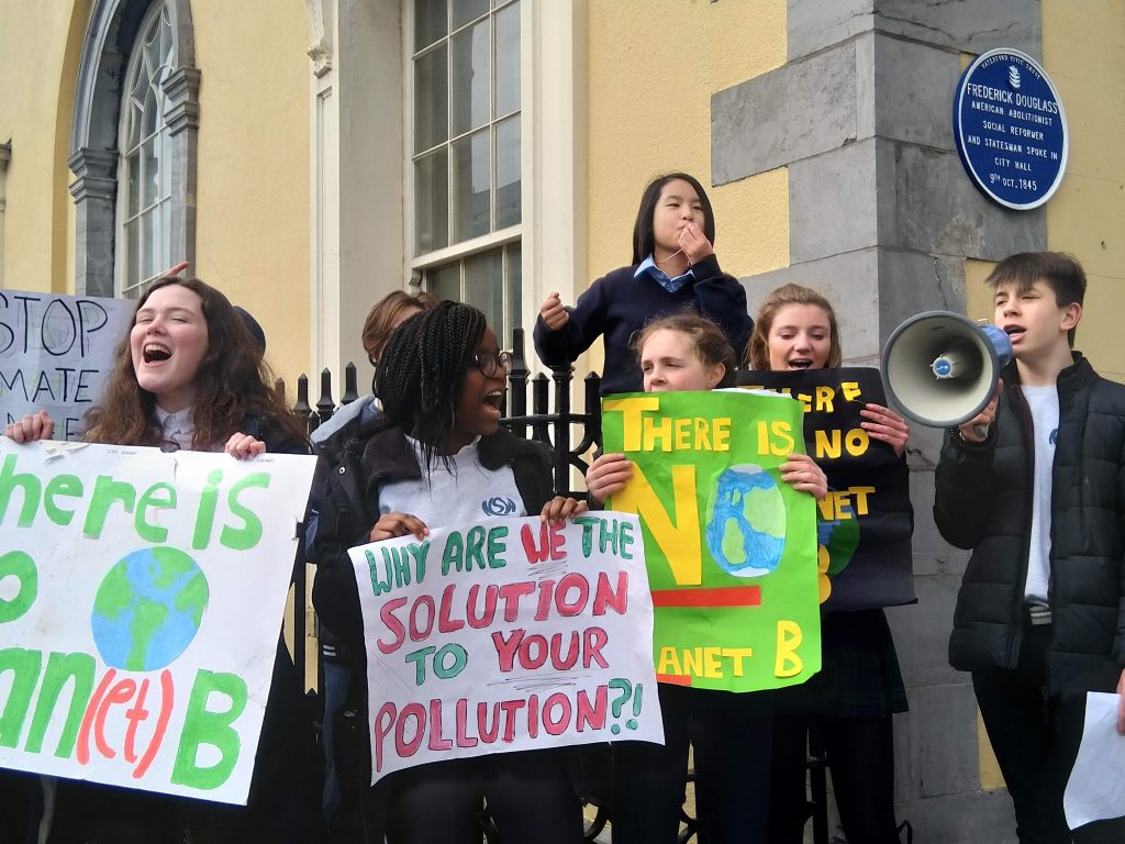Students gathered outside City Hall beneath the Civic Trust plaque dedicated to when the great reformer Frederick Douglas spoke in Waterford