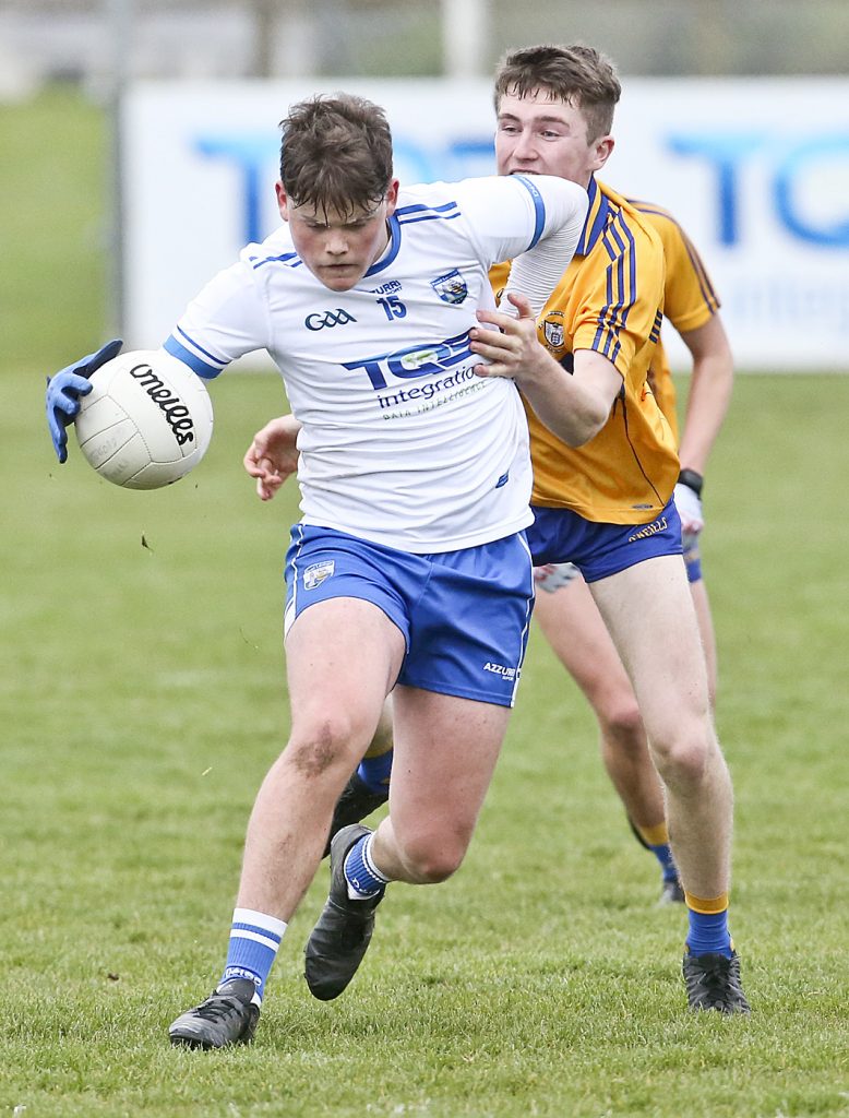 Waterford's Tom O'Connell with the ball against Clare's Keith Crowley 