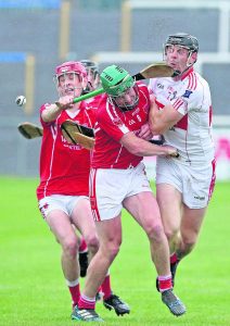 De La Salle’s Kevin Moran takes a hard tackle from Passage’s Thomas Connors