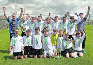 The Glór Na Mara team celebrate their cup final win.