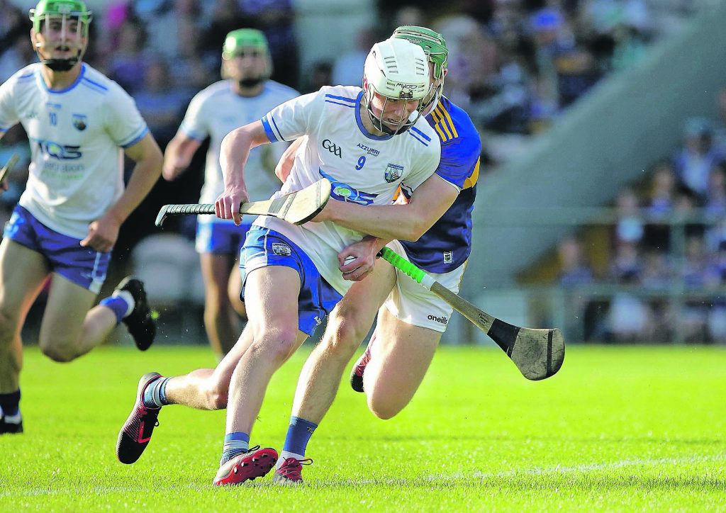 . Waterford’s Billy Power gets past Tipperary’s Paddy Cahill