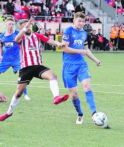  Blues captain Rory Feely shoots for goal against Derry City