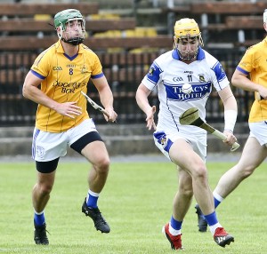 Mount Sion’s Martin F O’Neill with the sliothar against Fourmilewater’s Seamus Lawlor in the last of the group games at Fraher Field.  Photo: Séan Byrne  