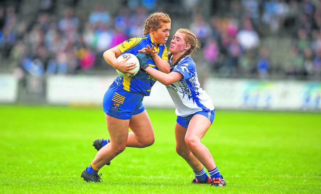 Molly Mulvhill of Longford challenged by Waterford’s Megan O'Grady 