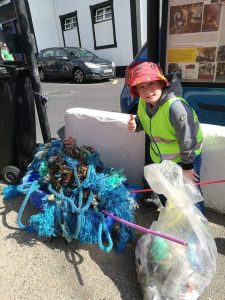One of Tramore Tidy Towns’ young helpers hard at work.