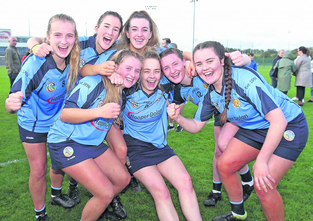 Gailltír team members celebrate at the final whistle.