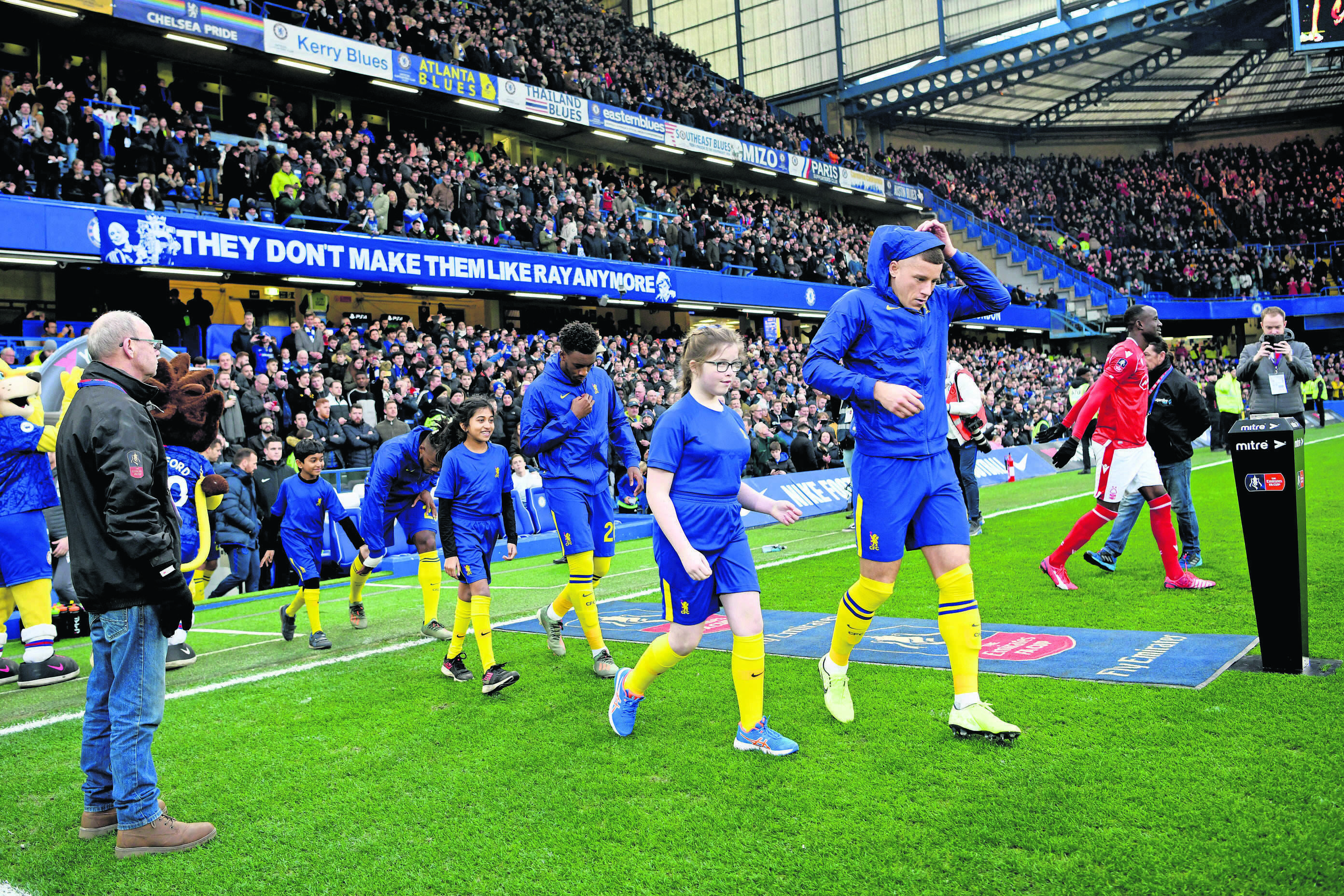 Taylor and Adam Tebay walk out at Stamford Bridge as mascots for Chelsea for the FA Cup match against Nottingham Forrest
