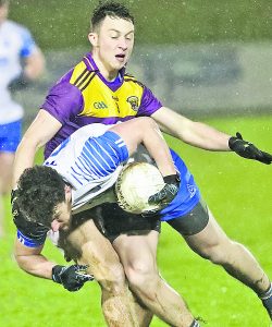 Waterford's Jason Gleeson is tackled by Wexford's Eoghan Nolan 