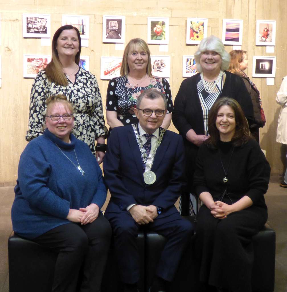 Pictured at the launch of “New Shoots”, an exhibition of photographic images captured by users of the HSE’s mental health services locally and for the month of February in Waterford’s Central Library: (Seated left to right): Margaret Organ (Arts Officer, Waterford City and County Council), Mayor of Waterford City and County Cllr. Séamus Ryan and Gina Delaney (Development Officer/South East, Mental Health Ireland). (Standing, left to right): Eileen Byrne (Senior Occupational Therapist, HSE Waterford Mental Health Services), Sandra (a participant in the “New Shoots” programme) and visual artist Rosaleen Heavin.